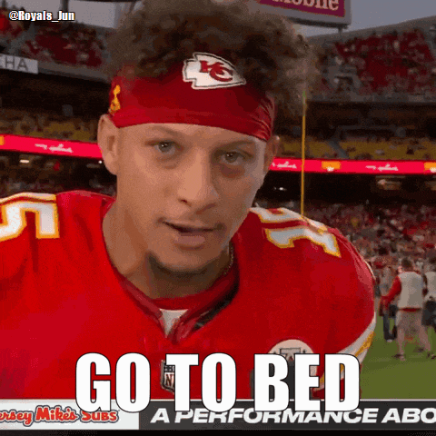 a football player wearing a headband with the letters kc on it
