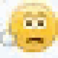 a close up of a yellow smiley face with a blurred background on a white surface .