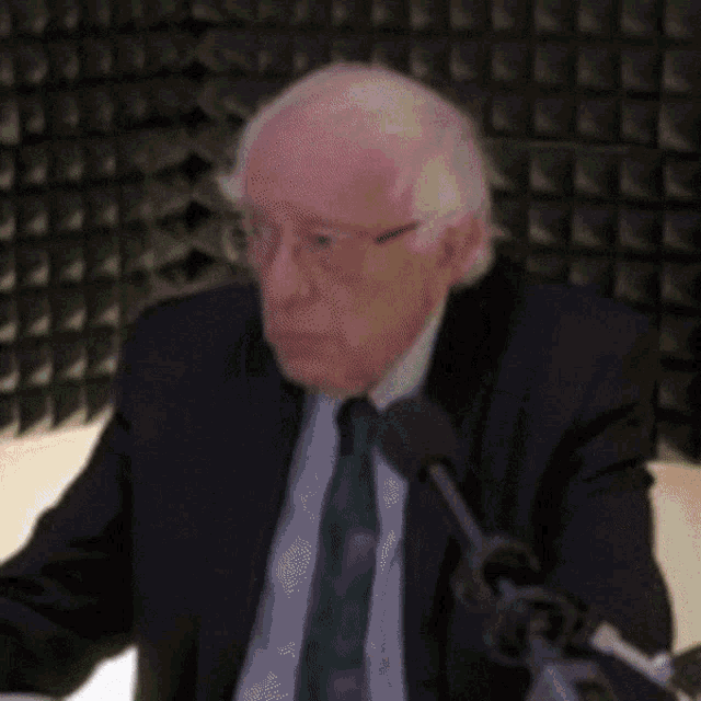 a man in a suit and tie has green lines coming out of his face