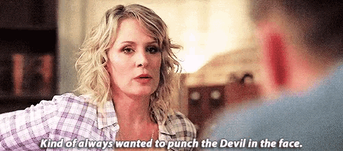 a woman is talking to a man and says `` kind of always wanted to punch the devil in the face '' .