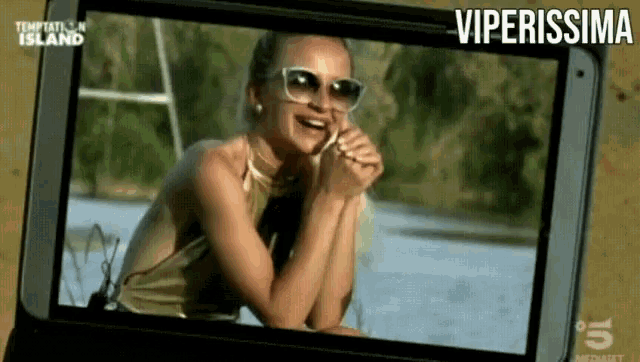 a picture of a woman on temptation island is displayed on a screen