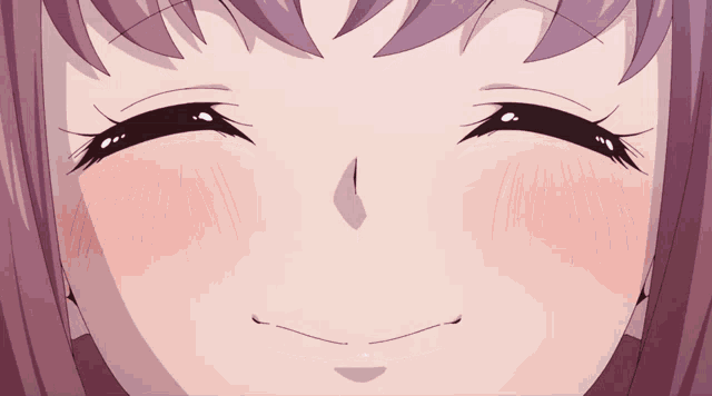 a close up of a girl 's face with a smile