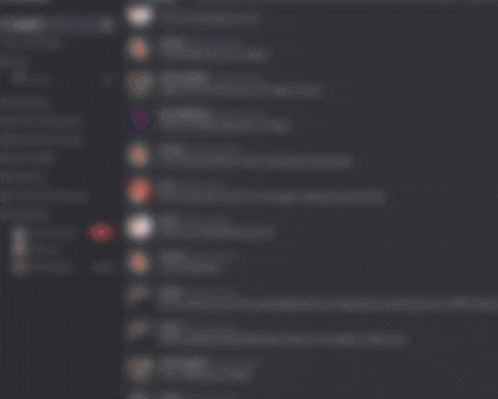 a man with glasses and a beard stands in front of a black screen