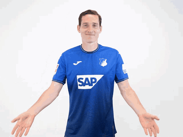 a man is wearing a blue shirt with the word sap on it