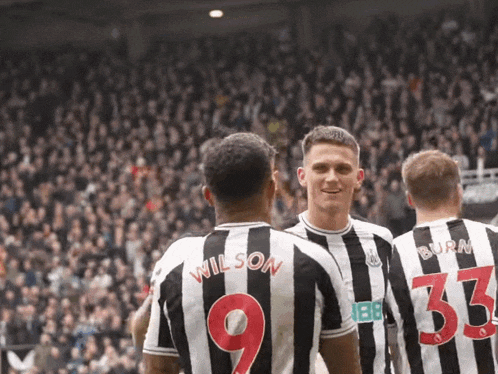 three soccer players wearing black and white striped jerseys with wilson 9 and burn 33 on them
