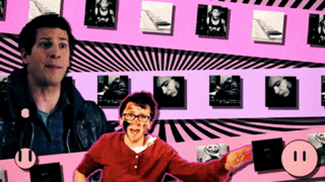 a man in a red shirt is standing in front of a pink wall