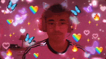 a man wearing headphones is surrounded by rainbow butterflies and hearts