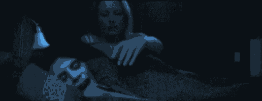 a blue smoke coming out of a dark room