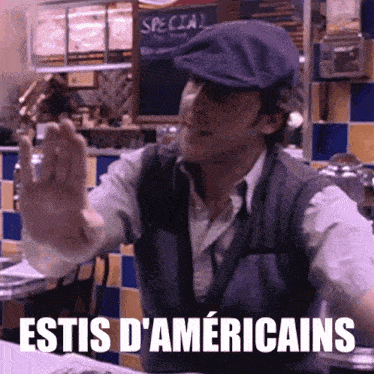a man wearing a hat and a vest says " estis d' americains " in a restaurant