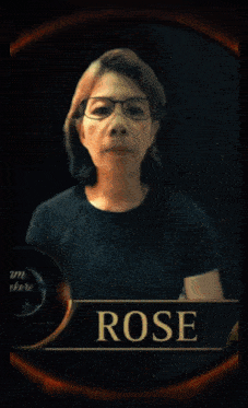 a woman wearing glasses and a black shirt is named rose