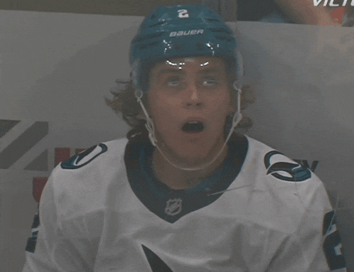 a hockey player wearing a helmet that says bauer on it