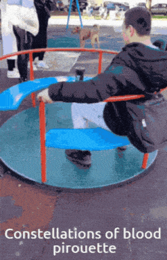 a man is sitting on a merry go round with the words constellations of blood pirouette below him