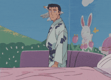 a man in a kimono is standing in front of a bunny rabbit