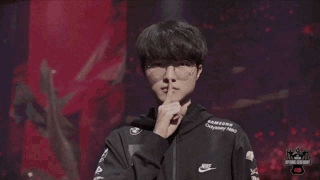 a man wearing a hoodie that says samsung odyssey neo on it