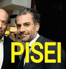 two men standing next to each other with the word pisei written in yellow