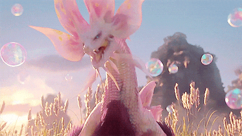 a dragon with pink wings is standing in a field with soap bubbles