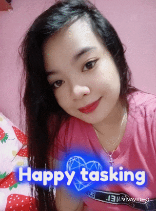 a girl in a pink shirt with the words happy tasking written on it