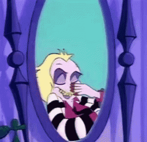 a cartoon character looking at herself in a mirror .