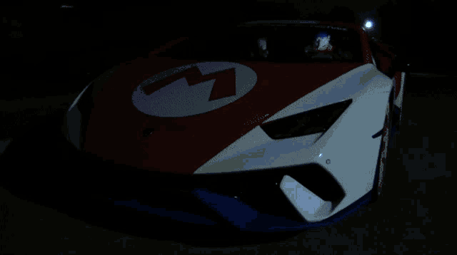 a car that has the letter m on the side of it