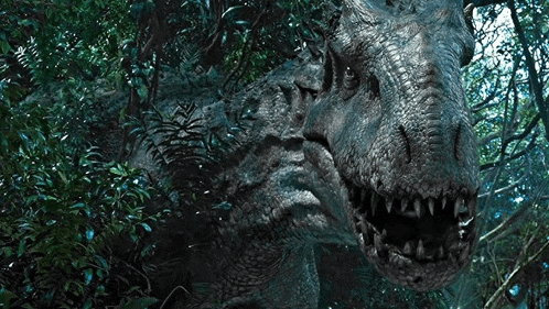 a large dinosaur is standing in the middle of a forest with its mouth open .