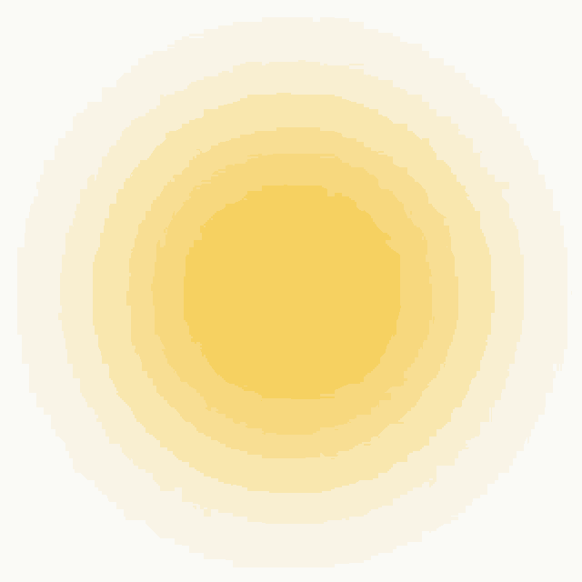 a yellow circle on a white background with a blurred effect .