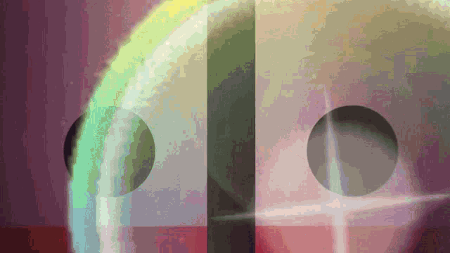 a colorful background with circles and a green circle in the middle