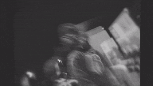 a blurry black and white photo of a person