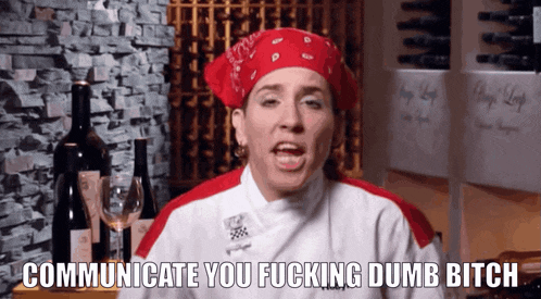 a chef says " communicate you fucking dumb bitch " in front of wine bottles