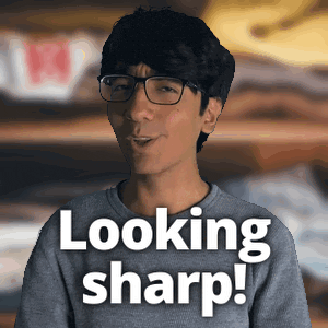 a man wearing glasses says looking sharp in white letters