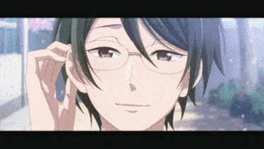 a close up of a person with glasses on