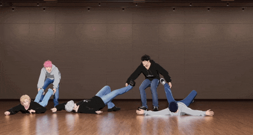 a group of people laying on the floor with one wearing a hoodie that says ' abercrombie & fitch ' on it