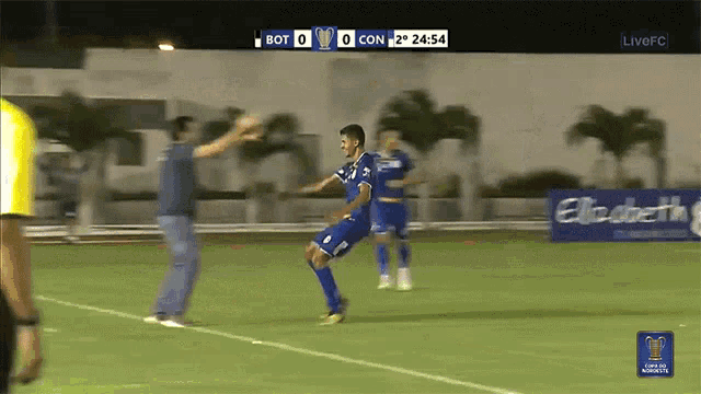 a soccer game is being played with the score being 0-0