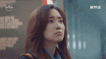 a close up of a woman 's face with a netflix logo on the bottom