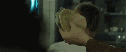 a person holding a stuffed animal in their hand