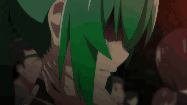 a girl with green hair covering her face with her hands
