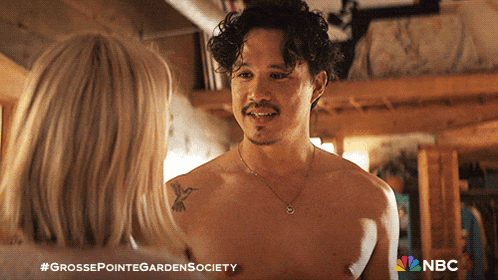 a man without a shirt is standing next to a woman with #grossepointegardensociety written below him