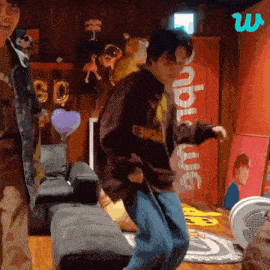 a man wearing a sweatshirt that says supreme is dancing