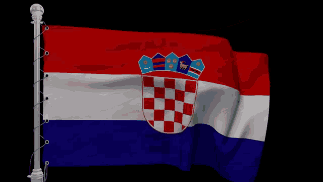 a red white and blue flag with a crown on the top