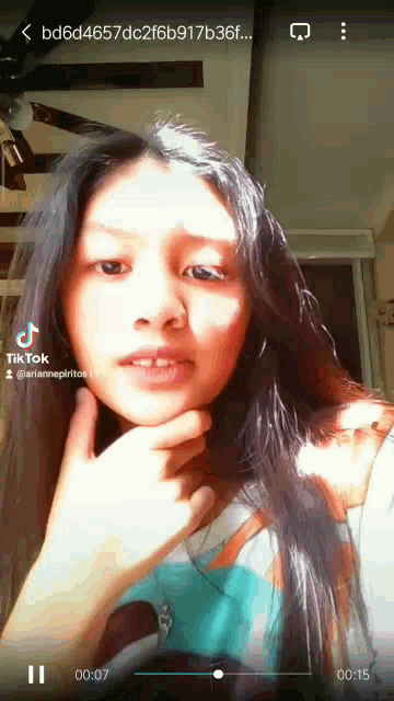 a tiktok video of a young girl with a missing tooth