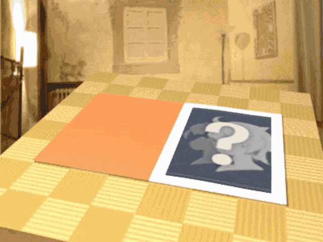 a picture on a table with a question mark on it