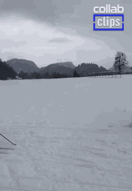 a woman is skiing in the snow with a collab clips logo in the background