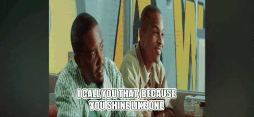 two men are sitting at a table and one of them says " i call you that "
