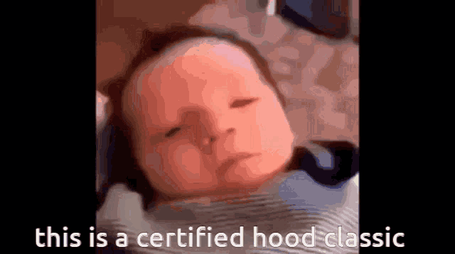 a close up of a baby with the words this is a certified hood classic