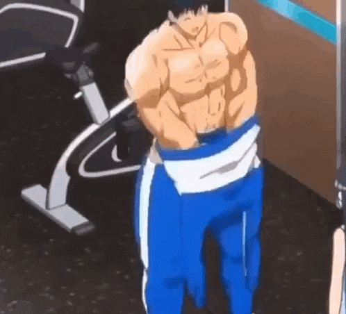 a muscular man is standing in a gym taking off his pants .