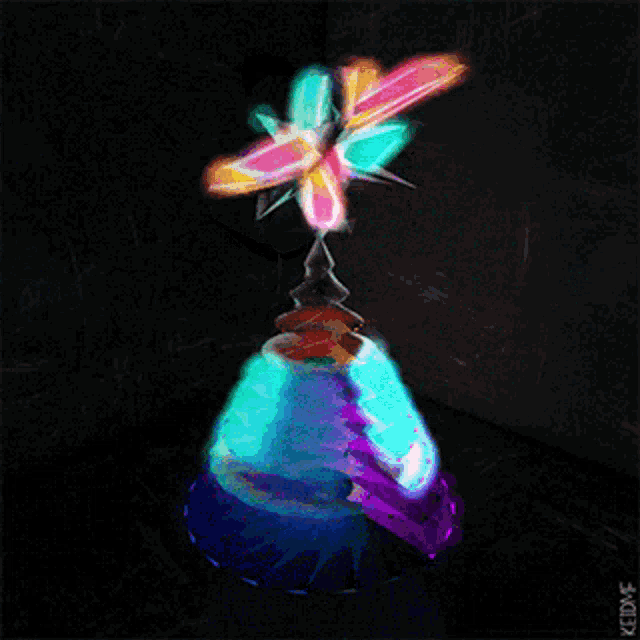a painting of a colorful object with the word keldmf on the bottom