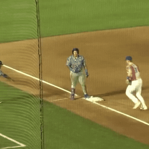 a baseball game is being played and the catcher is wearing a jersey that says blue jays