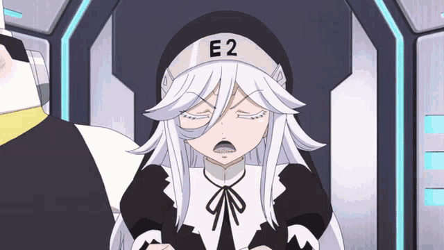 a girl with white hair and a hat with e2 on it