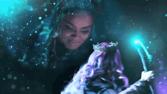a woman with purple hair and a crown on her head holds a magic wand