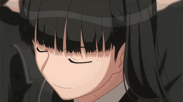 a close up of a girl with black hair and a white shirt