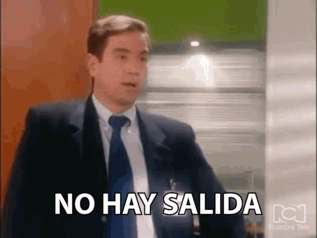 a man in a suit and tie is saying no hay salida in spanish .